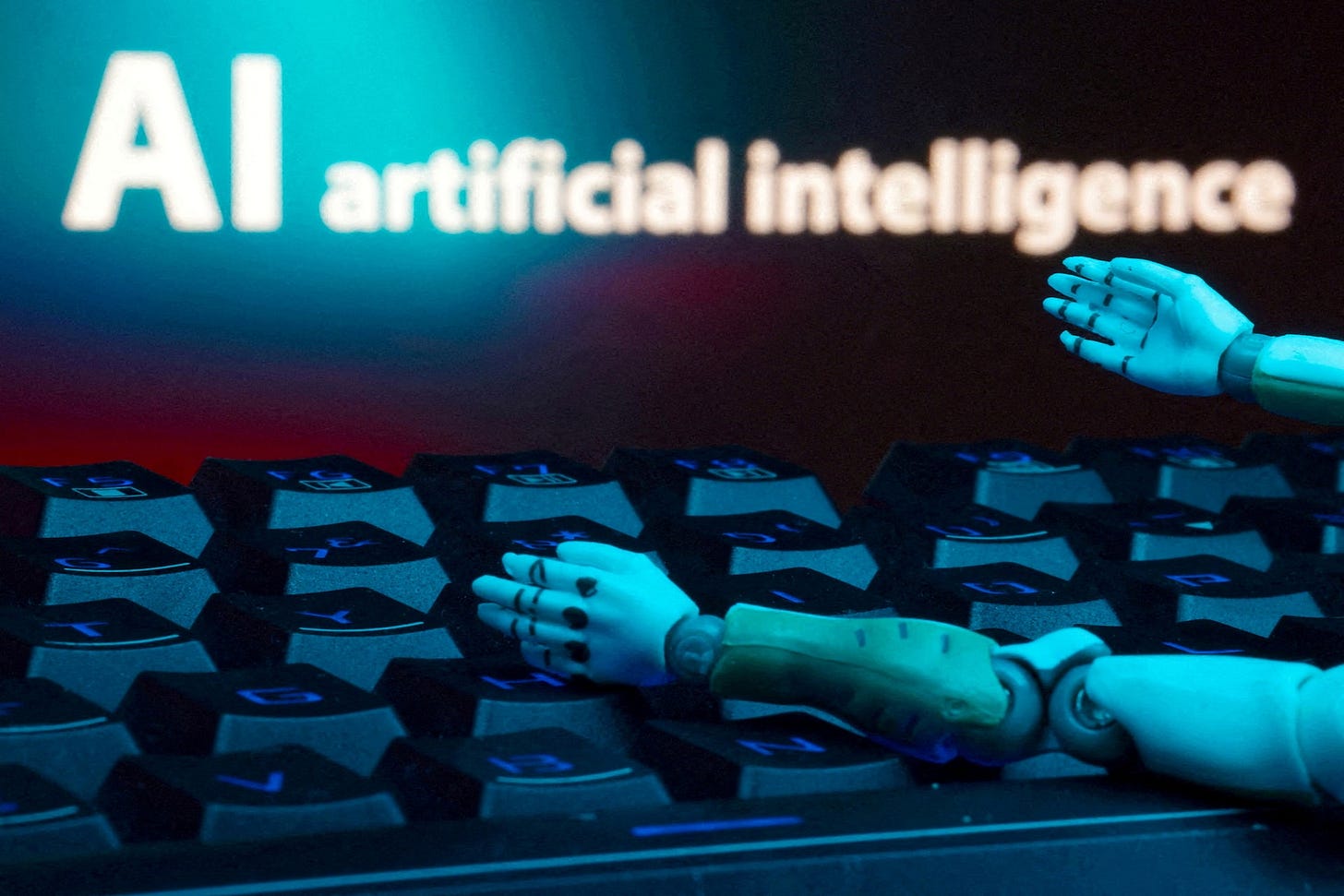 Illustration shows message reading "AI artificial intelligence," keyboard and robot hands Illustration shows message reading "AI artificial intelligence," keyboard and robot hands
