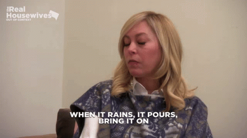 a woman says " when it rains it pours bring it on " while wearing a blanket a woman says " when it rains it pours bring it on " while wearing a blanket