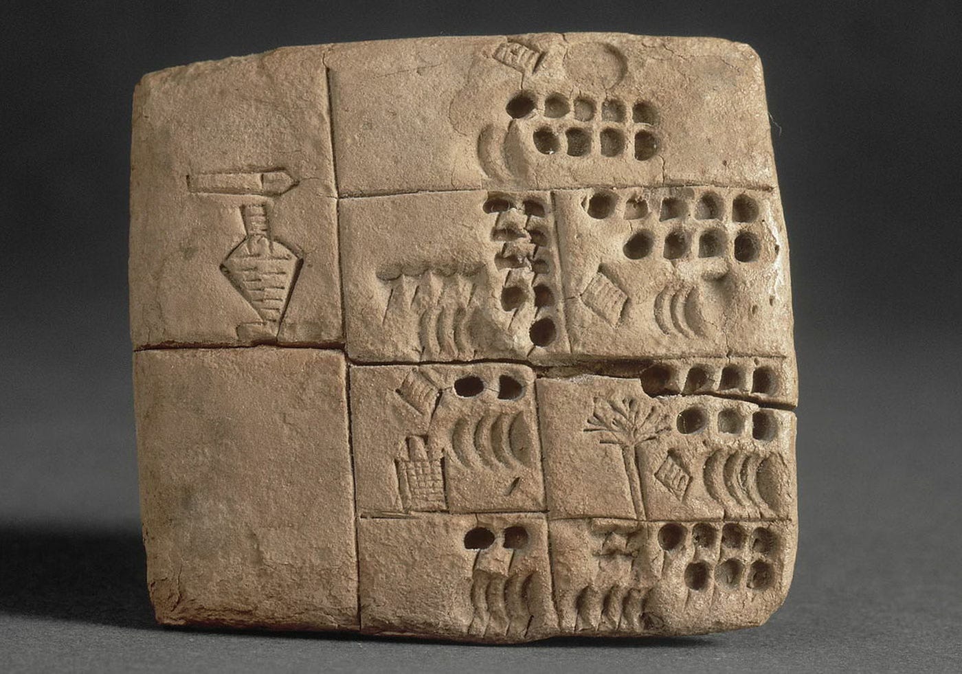 Proto-cuneiform tablet, circa 5,300 years old, Louvre museum Proto-cuneiform tablet, circa 5,300 years old, Louvre museum