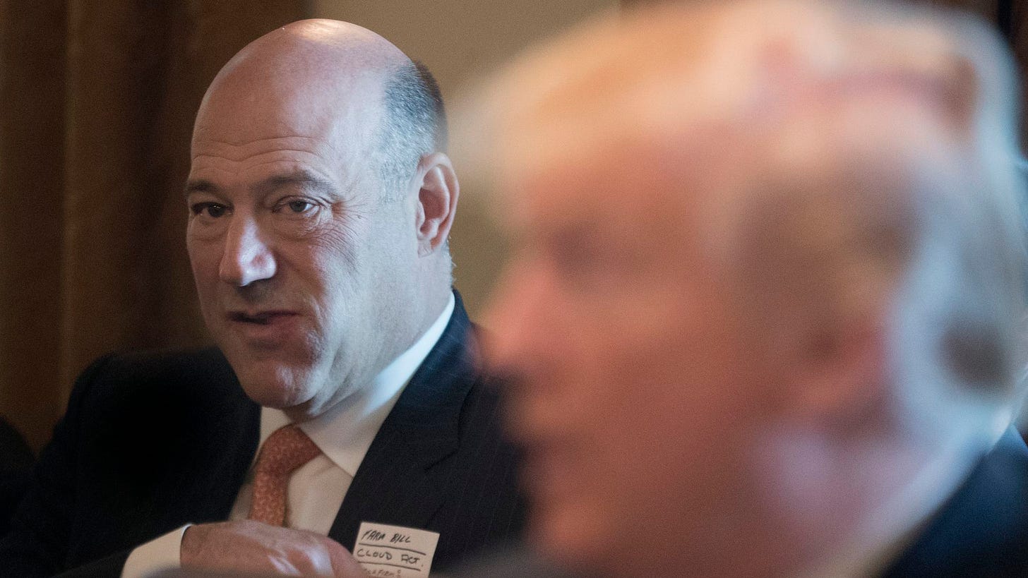 Gary Cohn, with Donald Trump's face blurred in the foreground.