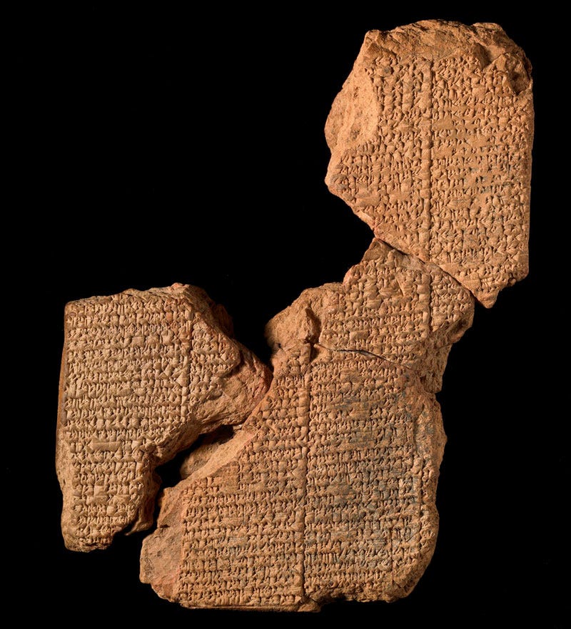 fragments of an anciet stone tablet with carvings