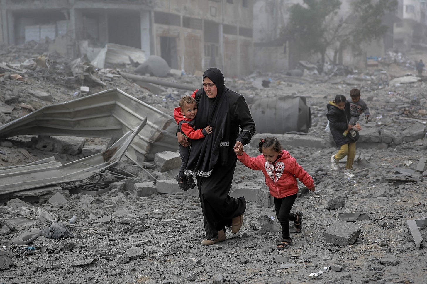 Palestinians flee the area after Israeli bombardment in central Gaza City on March 18, 2024, amid the ongoing battles between Israel and the militant group Hamas. (Photo by AFP)