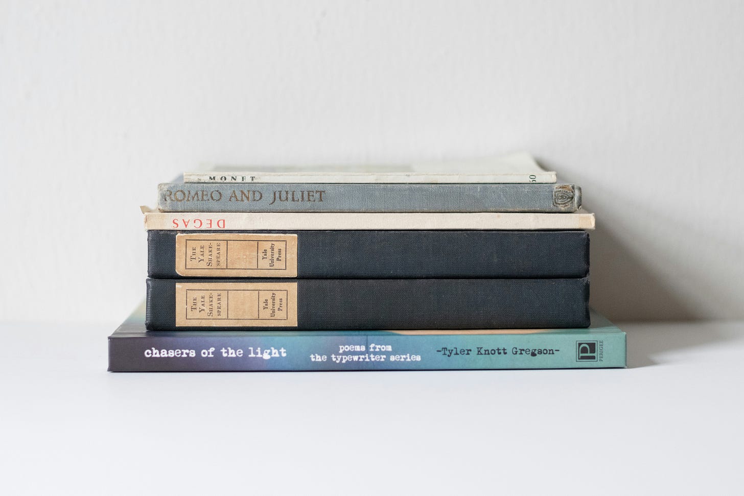 Six books (all plays of Shakespeare) stacked on top of one another Six books (all plays of Shakespeare) stacked on top of one another
