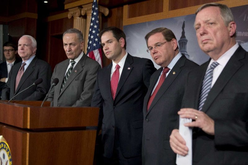Senator Marco Rubio listens alongside Senators John McCain, Chuck Schumer, Robert Menendez, and Dick Durbin during a press conference on immigration reform at the U.S. Capitol, January 28, 2013. Senator Marco Rubio listens alongside Senators John McCain, Chuck Schumer, Robert Menendez, and Dick Durbin during a press conference on immigration reform at the U.S. Capitol, January 28, 2013.