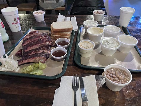 Hard Eight sign, grill, and trays with food