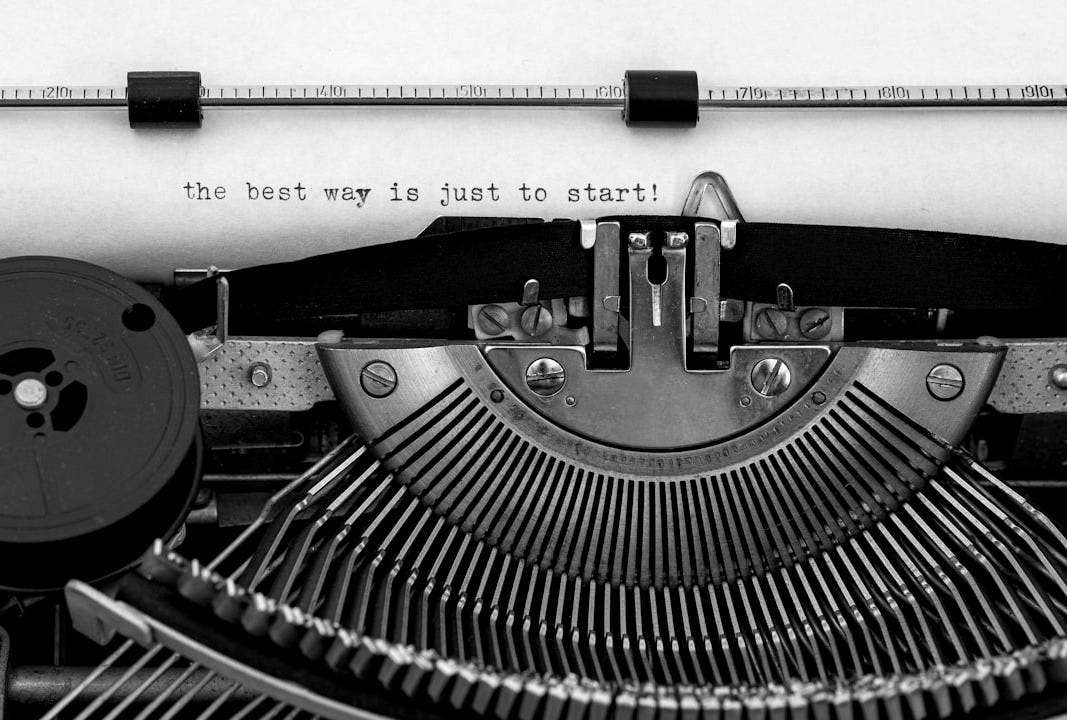 black and white typewriter on white table black and white typewriter on white table