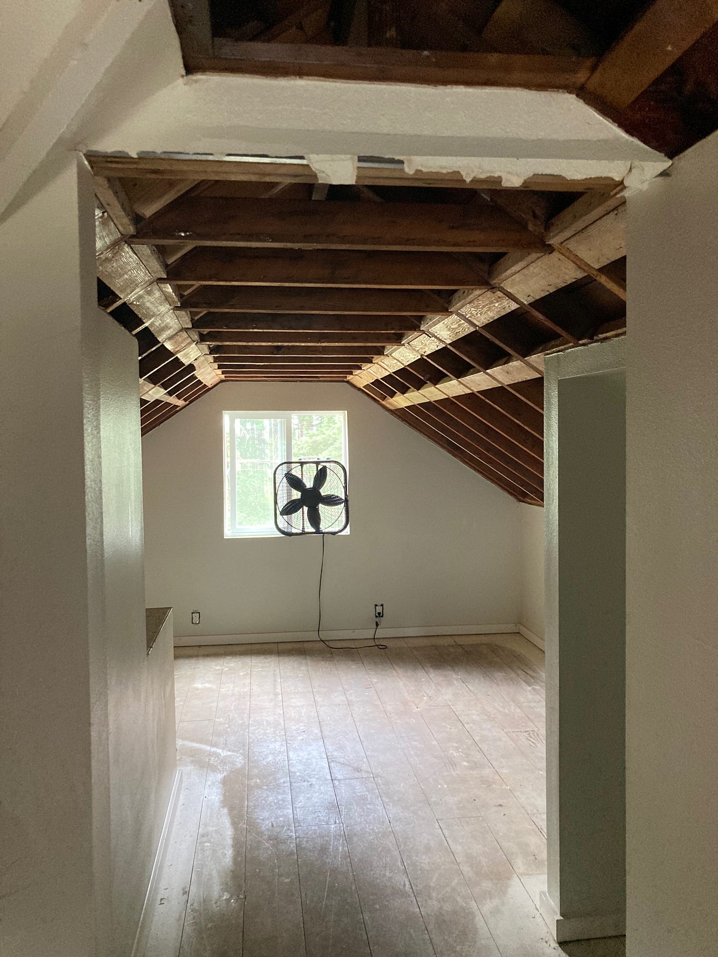 A partially-demolished attic room