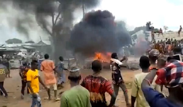 Killing in the name of God: fanatics burn a man to death in Nigeria over 'blasphemy'. Killing in the name of God: fanatics burn a man to death in Nigeria over 'blasphemy'.