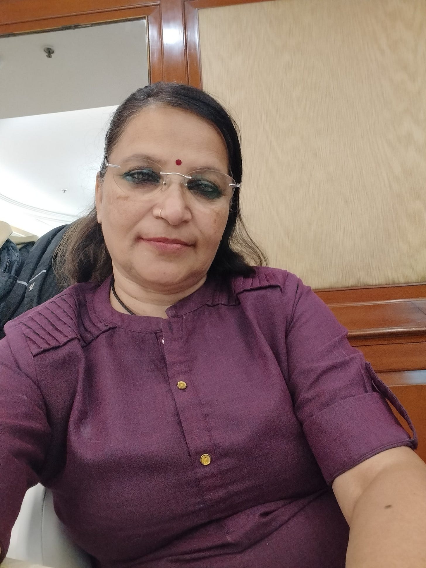 May be an image of 1 person, smiling and glasses