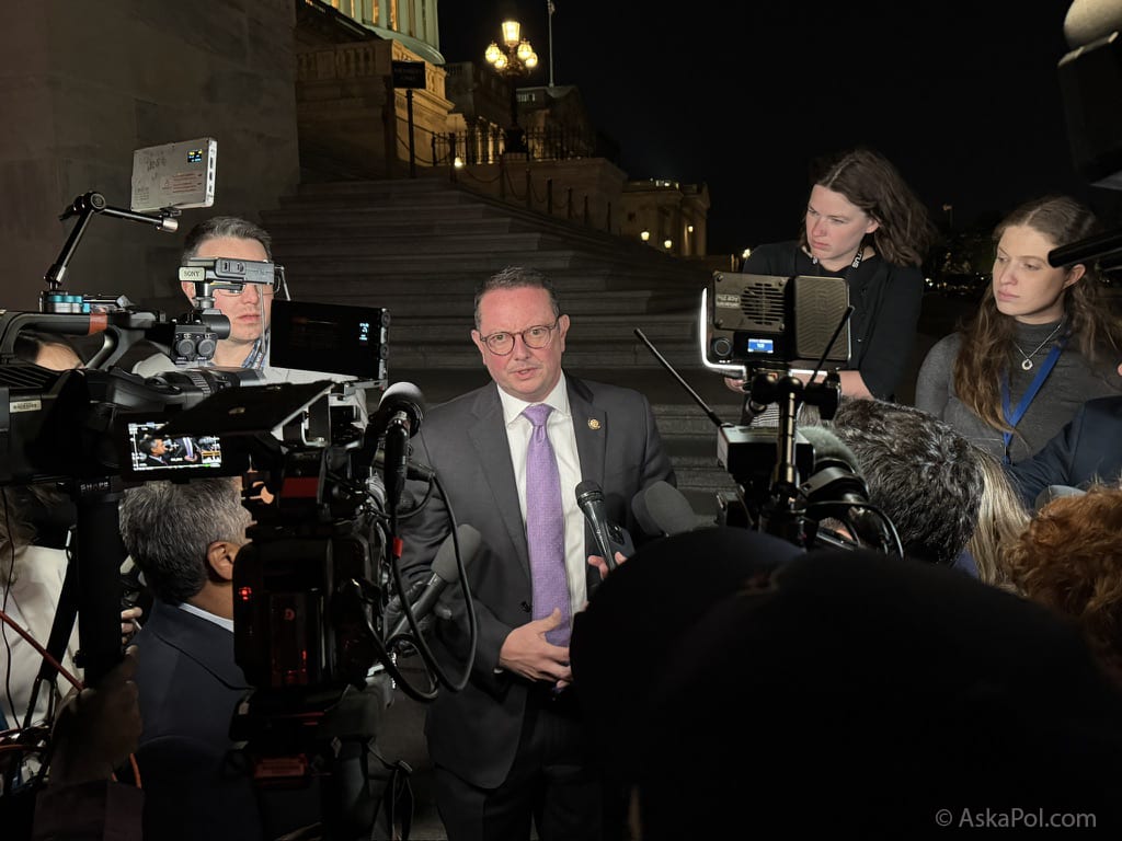 Politician surrounded by cameras at night answers reporter's questions Photo: Matt Laslo © www.askapoluaps.com