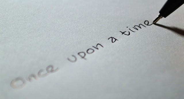 a pen and paper with the sentence — once upon a time indicating Copyrights for AI