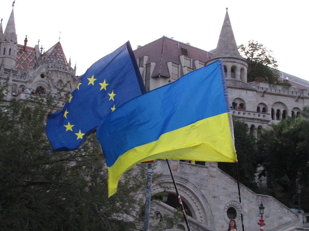Ukrainian and European Union flags at a protest in Budapest in July 2025