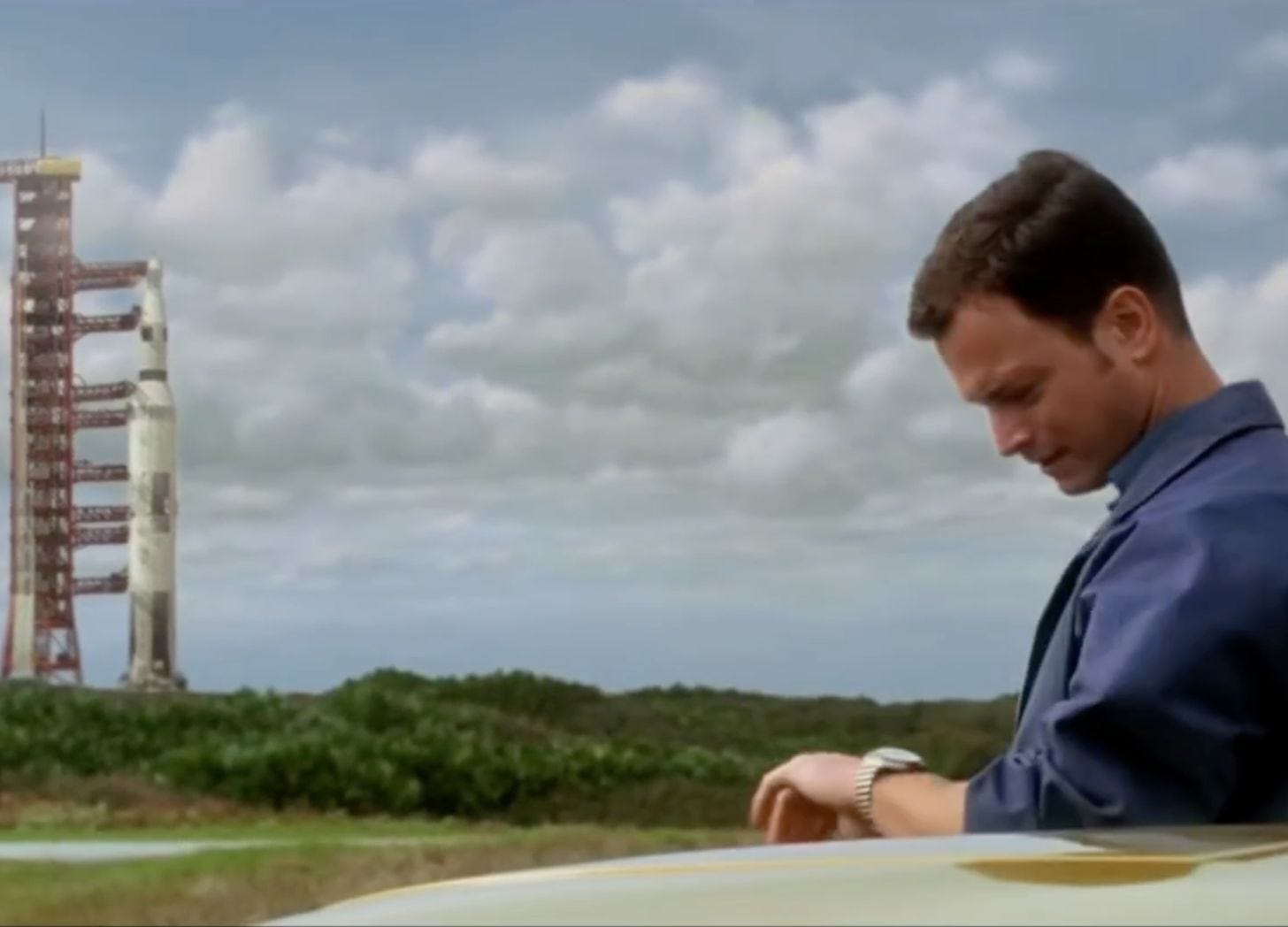 Gary Sinese in Apollo 13, checking his watch