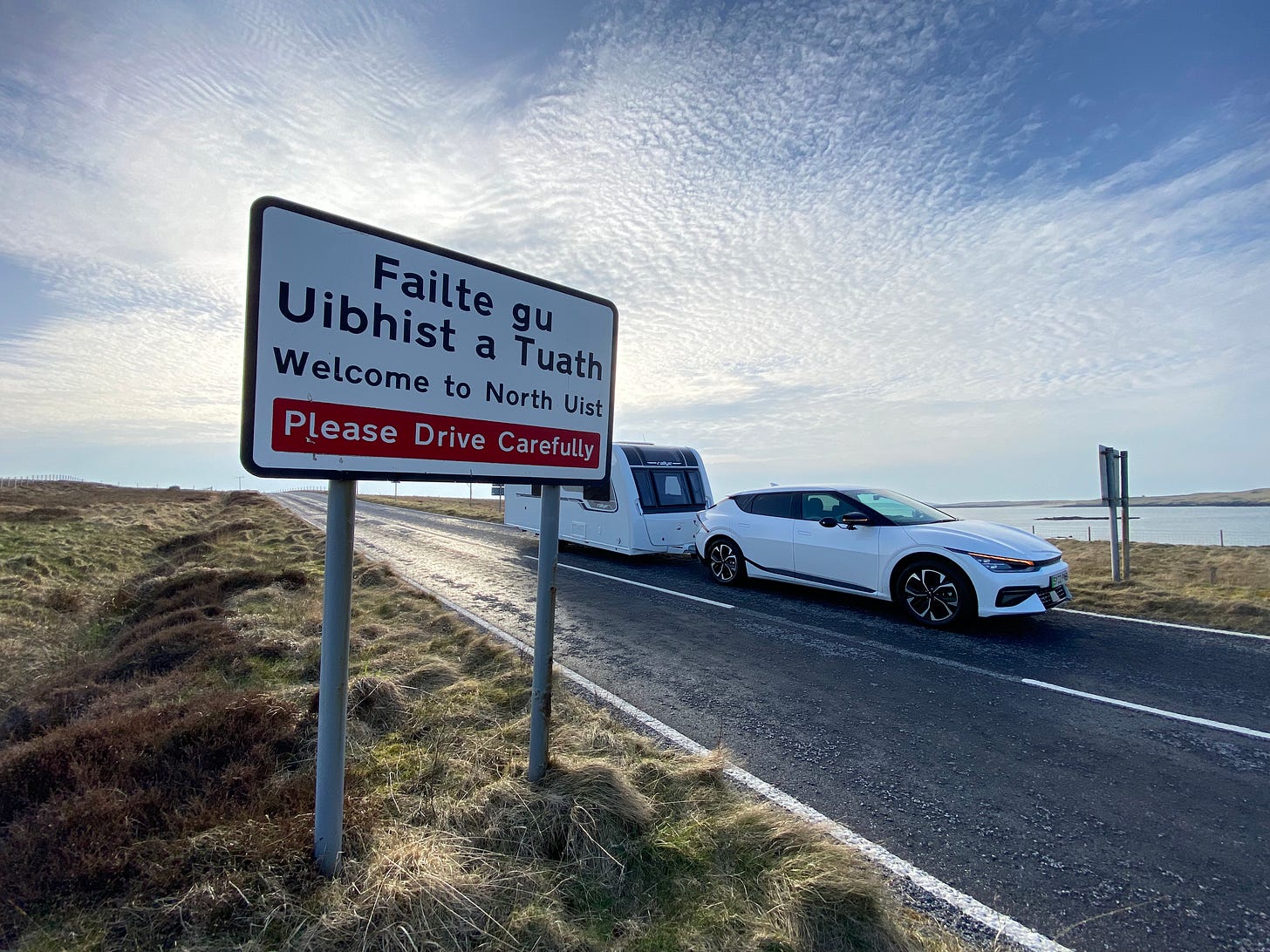Kia EV6 EV towing a caravan in North Uist Outer Hebrides Andrew Ditton