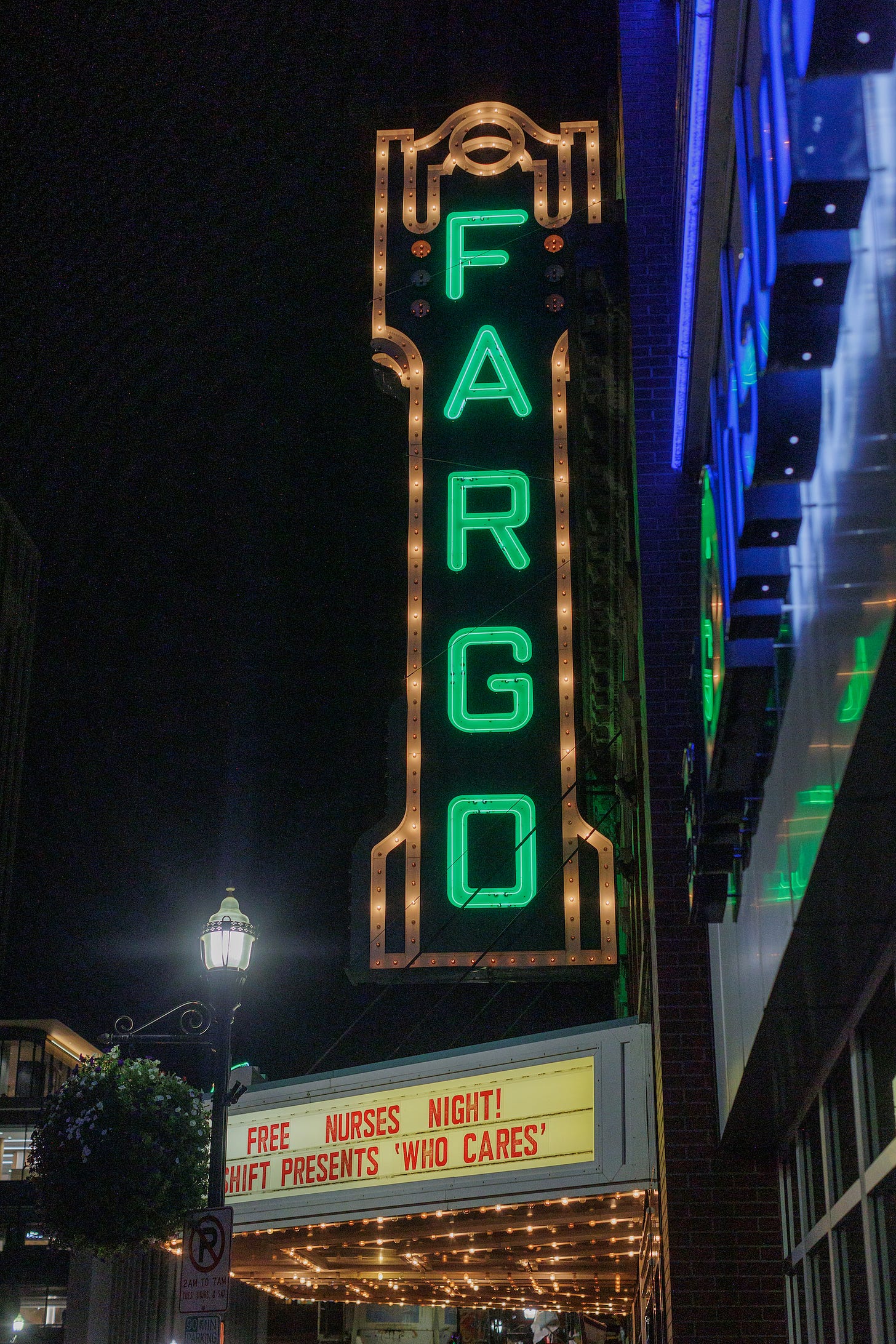 Sign outside Fargo Theater at night on Nurses Night at the Movies