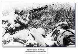 Russian nurse in a fox hole tending to a wounded soldier