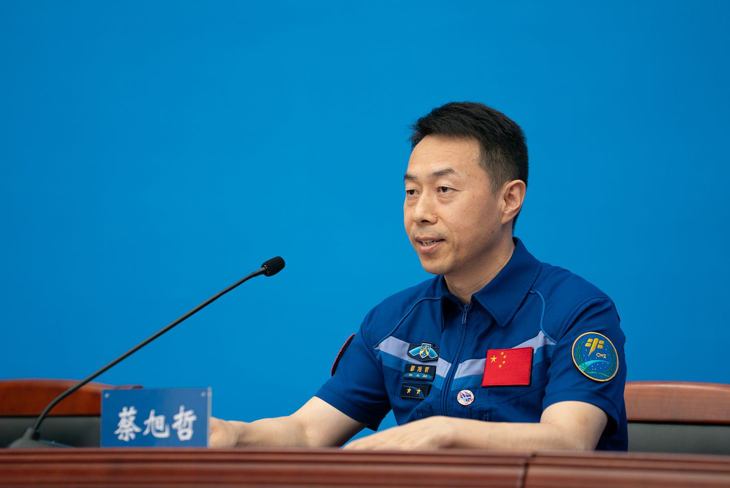 Shenzhou-19 Commander Cai Xuzhe speaks to the press.
