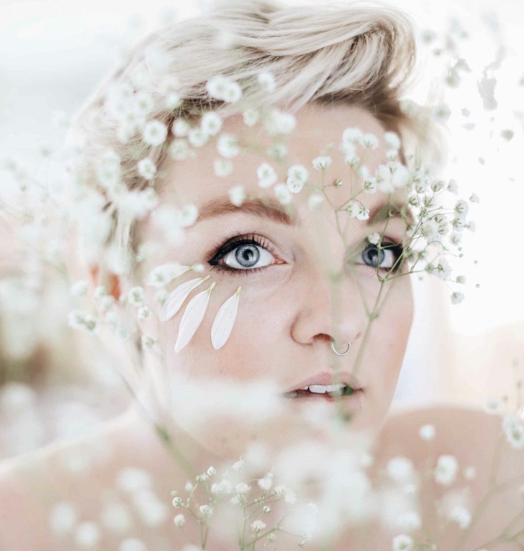 woman with blonde hair with water droplets