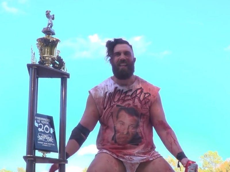[Screenshot: Big F'N Joe in crimson-soaked Rob Black shirt with the ToD 20 trophy]