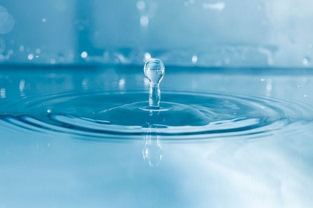 Free Photo background of water and drop falling