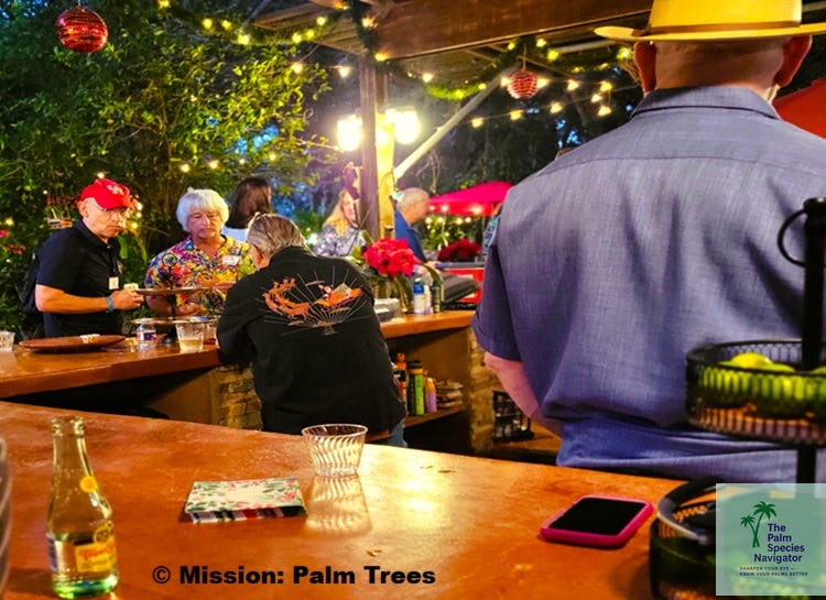 people ordering drinks around an outdoor bar people ordering drinks around an outdoor bar