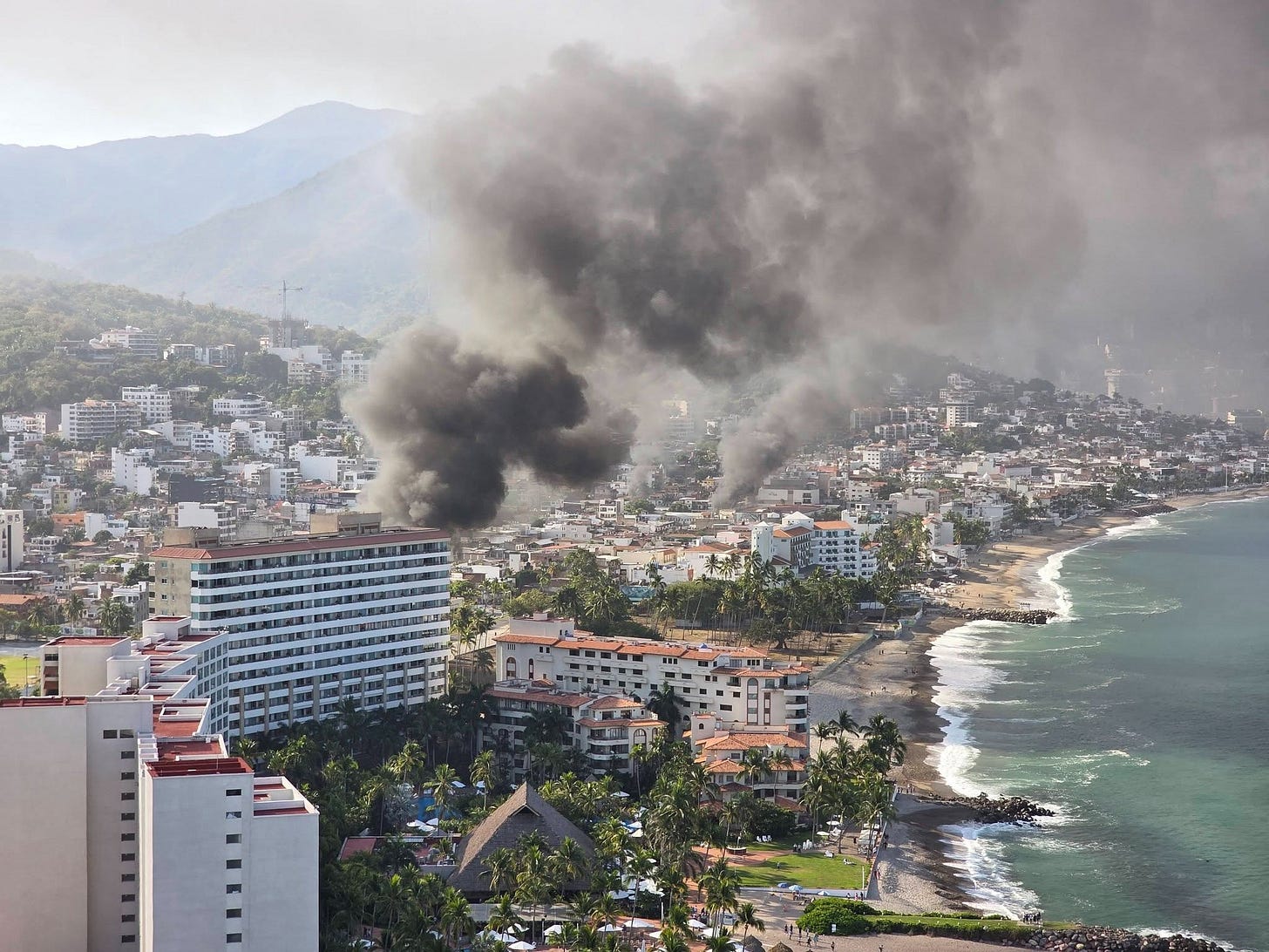 Smoke from fires rises above the Tourist Zone of Puerto Vallarta on Sunday, February 22, 2026 Smoke from fires rises above the Tourist Zone of Puerto Vallarta on Sunday, February 22, 2026