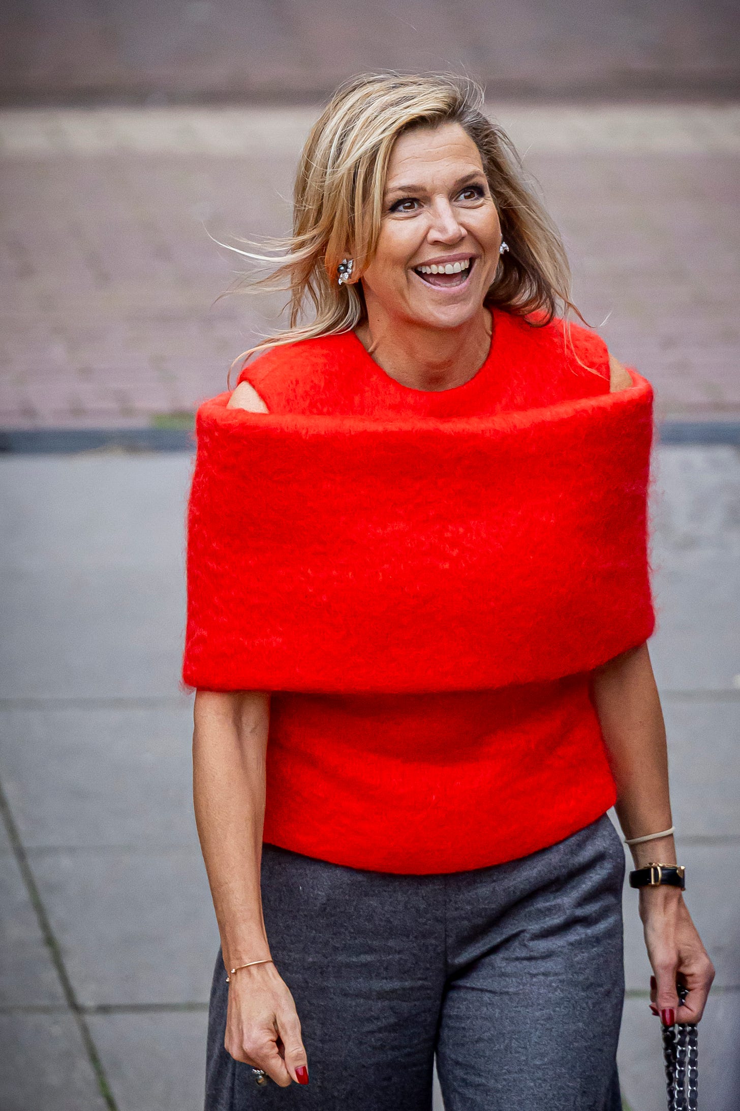 Queen Maxima in an orange top Queen Maxima in an orange top