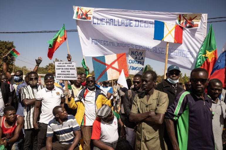 Demonstrators hold placards during a protest to support Burkina Faso's president, Captain Ibrahim Traore, and to demand the departure of France's ambassador and military forces, in Ouagadougou, on January 20, 2023. Demonstrators hold placards during a protest to support Burkina Faso's president, Captain Ibrahim Traore, and to demand the departure of France's ambassador and military forces, in Ouagadougou, on January 20, 2023.