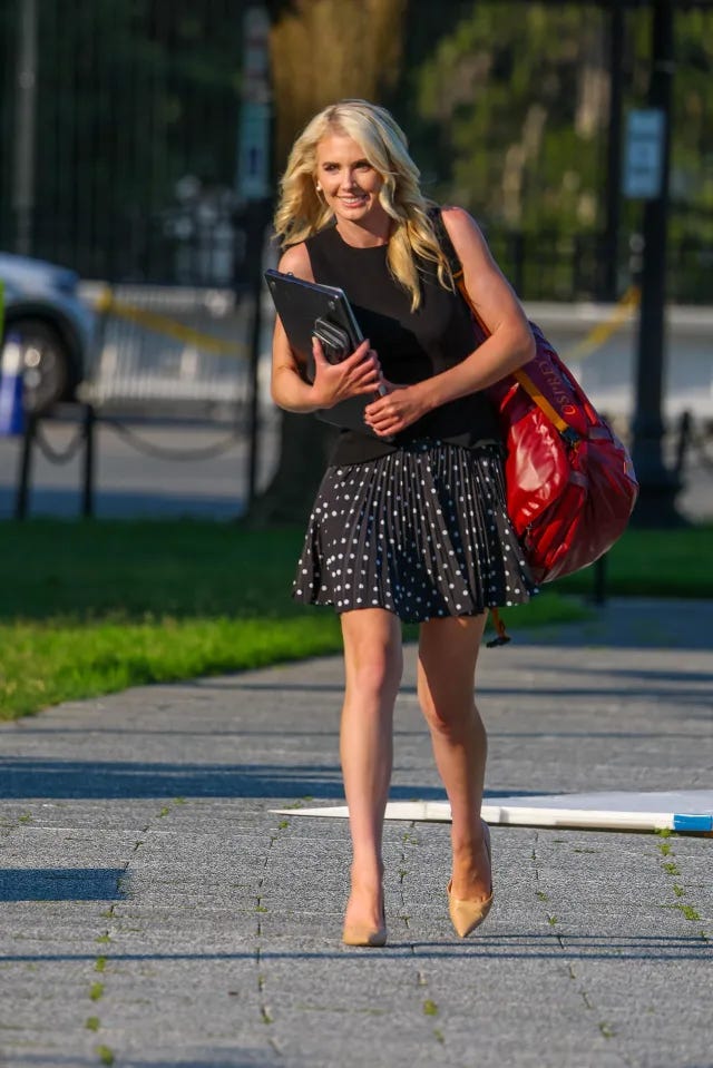 Natalie Harp, aide to U.S. President Donald Trump, smiles while walking on the Ellipse near the White House.