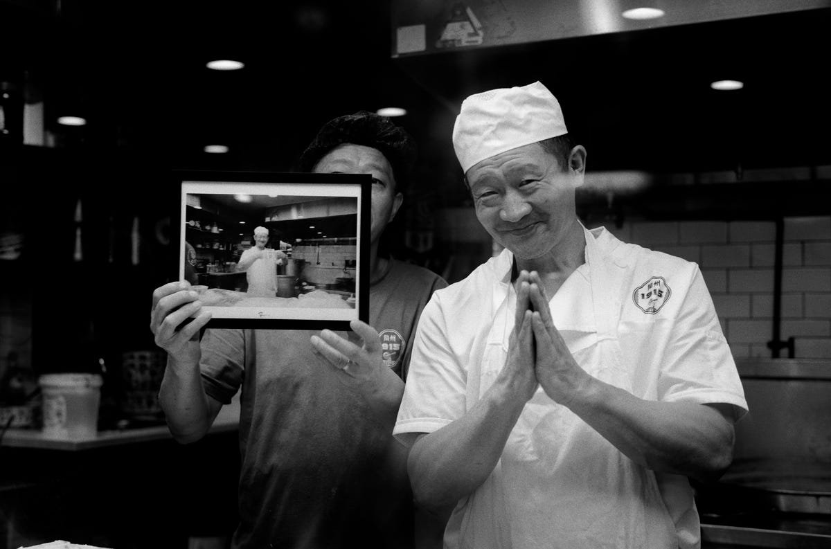 Chefs looking to my printed and framed picture.
