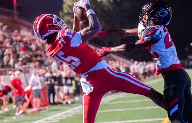 Mater Dei wide receiver Chris Henry, left, pulls in a pass to make the touchdown catch against Centennial in the second quarter in Santa Ana on Thursday, Aug. 22, 2024. Centennial defensive back Augus Saunders defends. (Photo by Paul Rodriguez, Contributing Photographer)