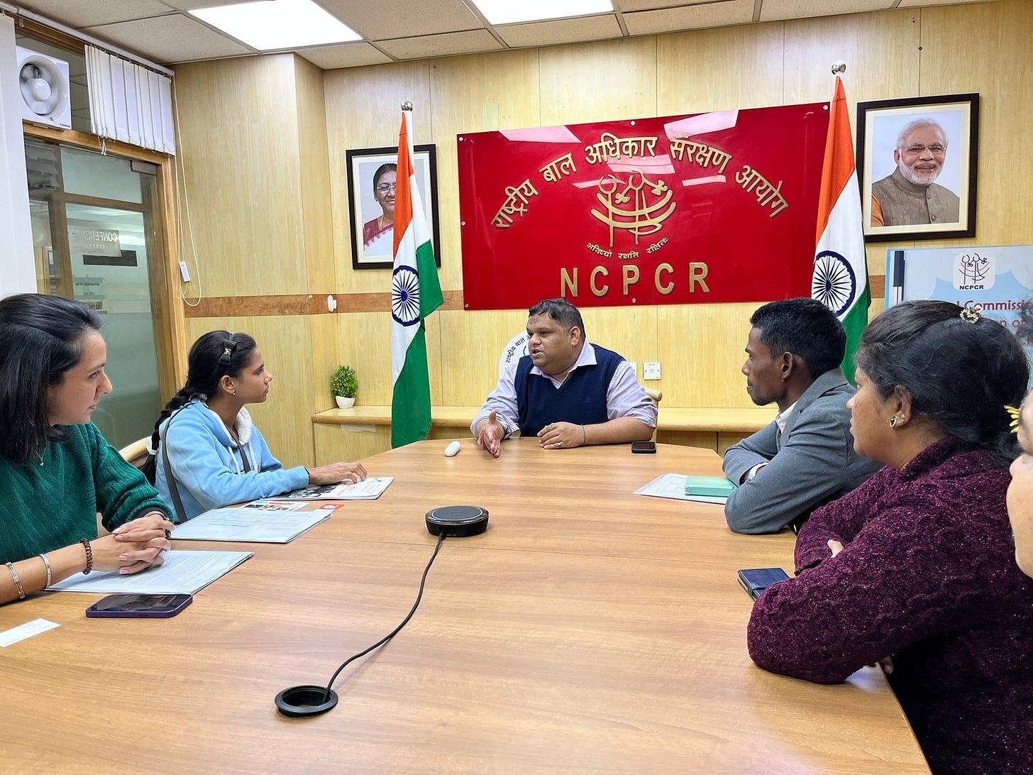 A group of people talking to each other sitting around a table in the office of National Commission for protection of Child Rights A group of people talking to each other sitting around a table in the office of National Commission for protection of Child Rights
