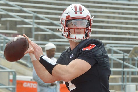 Wisconsin quarterbacks participate in individual position drills during Saturday's spring practice inside Camp Randall Stadium.