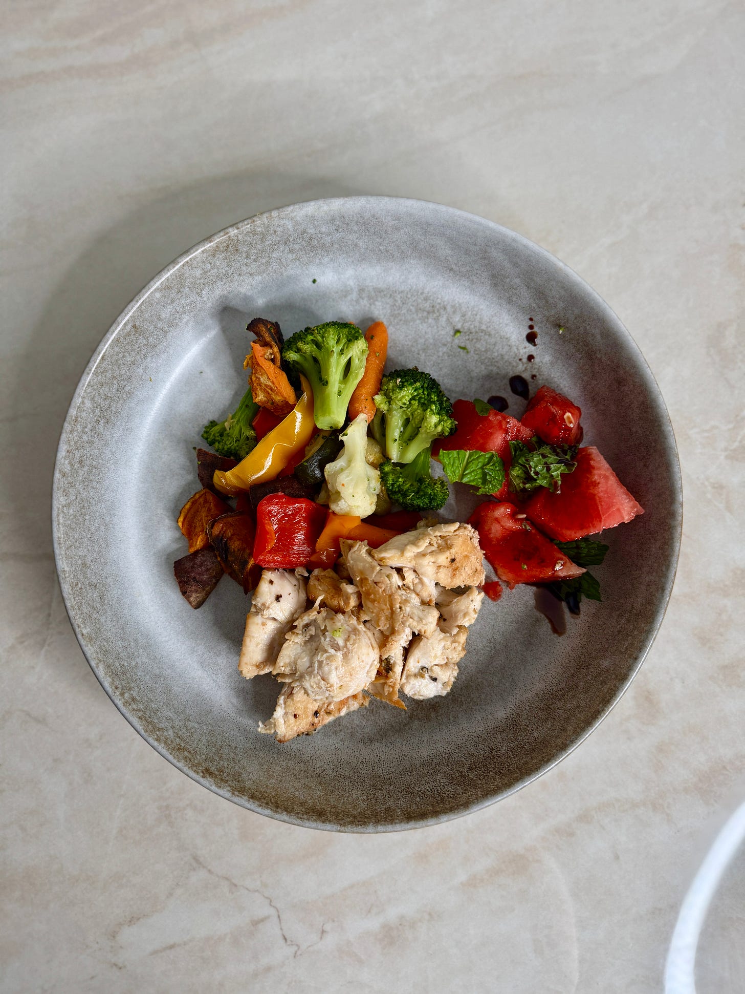 Red pepper chicken & roasted veggies with a side of watermelon and mint salad