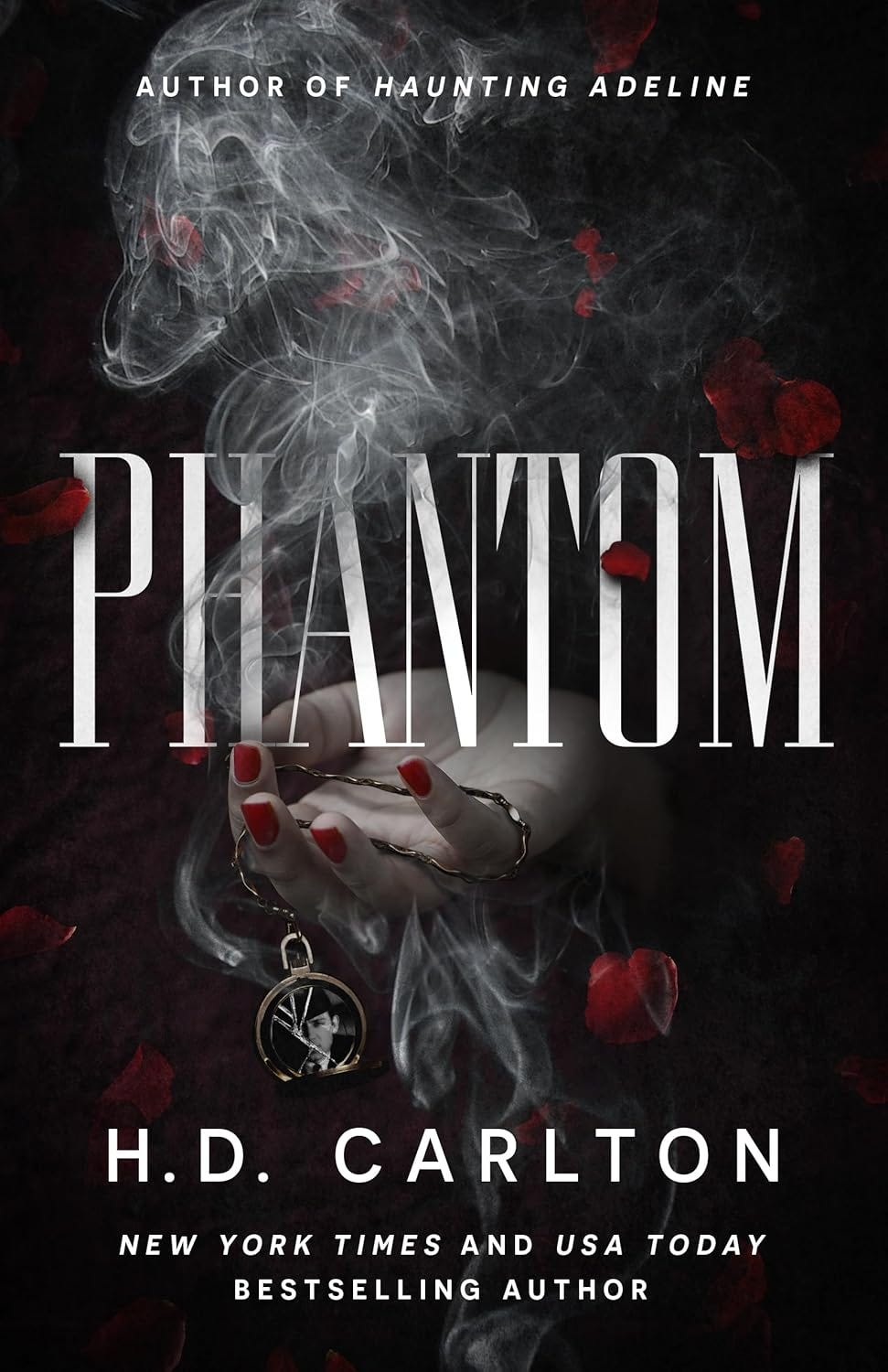 Cover of Phantom. Smoke and rose petals. Hand holding broken picture on a chain.