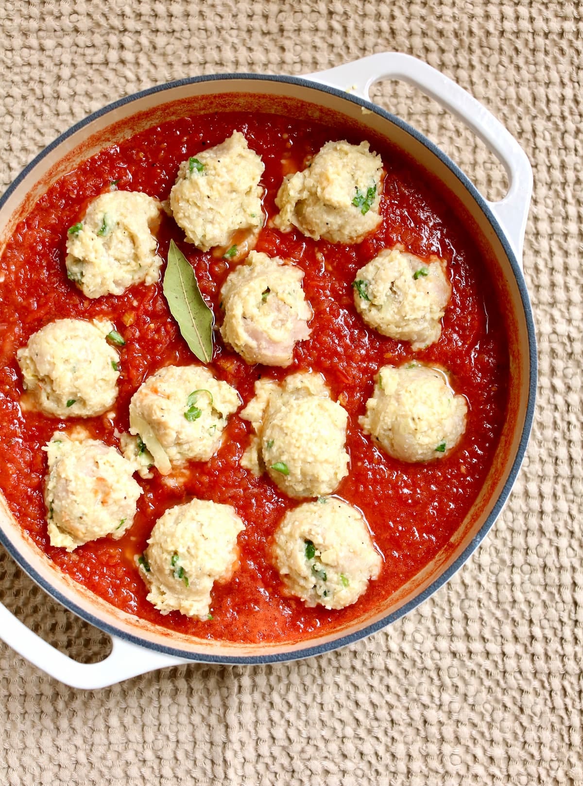 a pot of meatballs and marinara sauce.