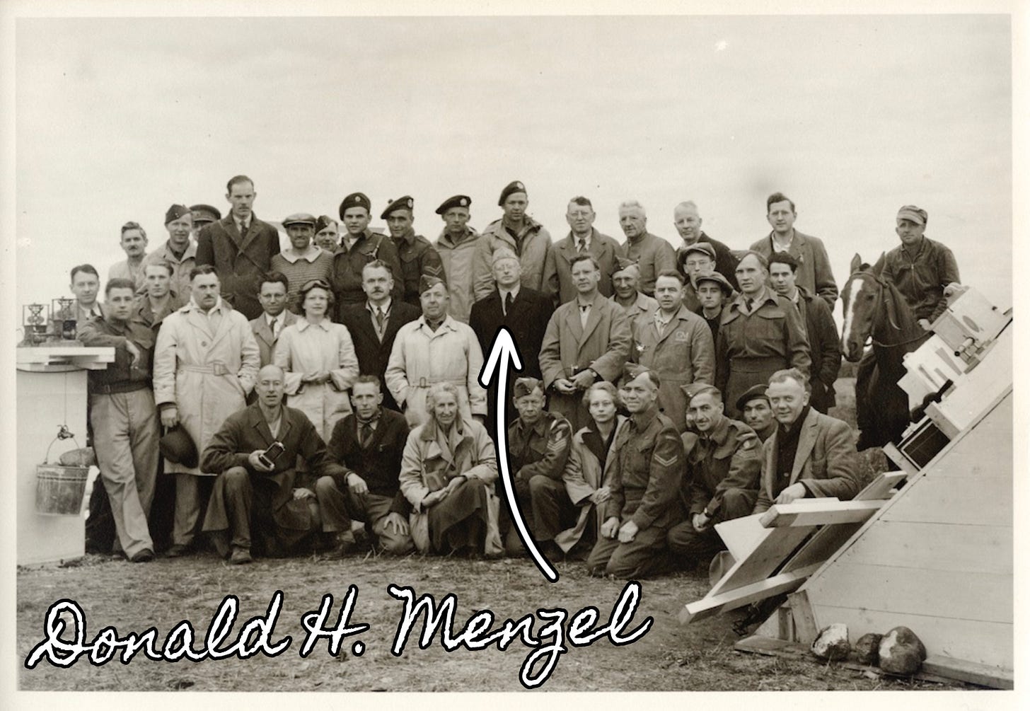 Center and labeled: U.S. Navy Reserve Commander Donald H. Menzel in his element with the solar eclipse team in Bredenbury, Canada, July 1945 Center and labeled: U.S. Navy Reserve Commander Donald H. Menzel in his element with the solar eclipse team in Bredenbury, Canada, July 1945