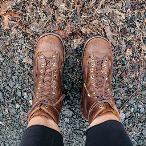Triptych: Bare feet walking on lava; Boots on gravel and a brown dog looking at the camera wanting to play fetch.