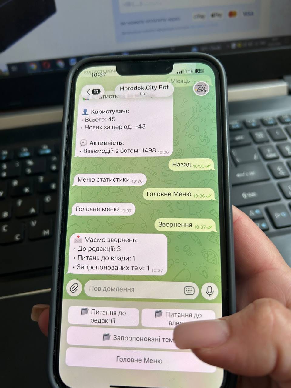 На зображенні може бути: телефон та текст «одо:зу-ач 10:37 .il LTE 78 Мисяць Horodok.City Bot 19 бот тисти. City 오 Користувачй: Всього: Всього:45 45 Нових за период: +43 Активнасть: Взаемодий 3 ботом: 1498 10:06 MeHIO статистики 10:36 Назад 10:36 Головне меню 10:37 Головне Меню 10：36～ ONt Звернення 10:37 Maemo звернень: ·До едакц: 3 •Питань до влади: 1 Запропонованих тем: 1 10:37 Повидомлення Питання до редакцё Питання до влал Запропоновани TeM Головне Меню»