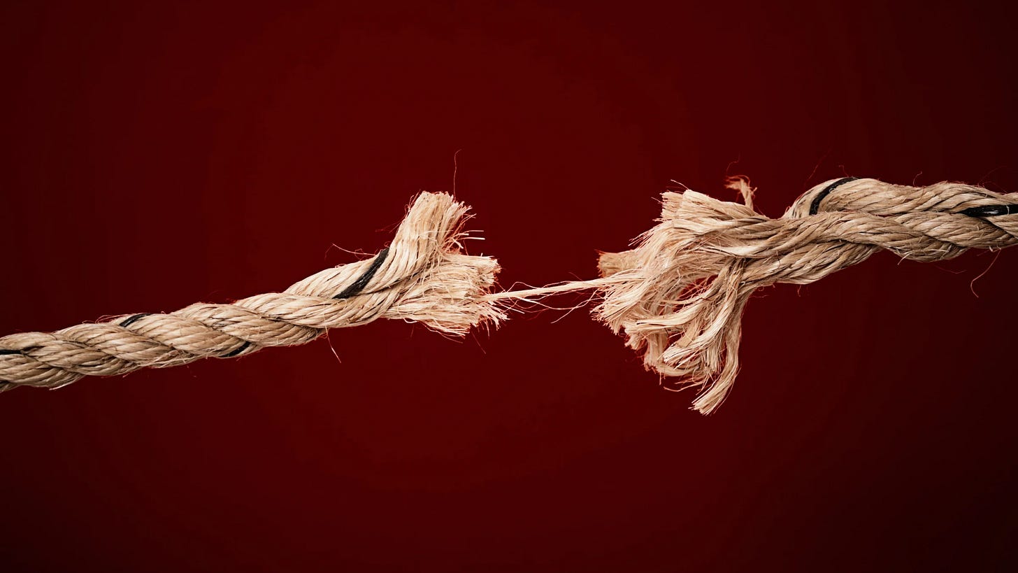 frayed rope. Last frayed strand of rope about to snap frayed rope. Last frayed strand of rope about to snap