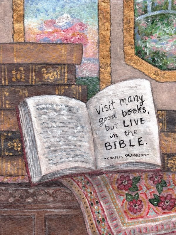 This may contain: an open book sitting on top of a table next to a pile of old books