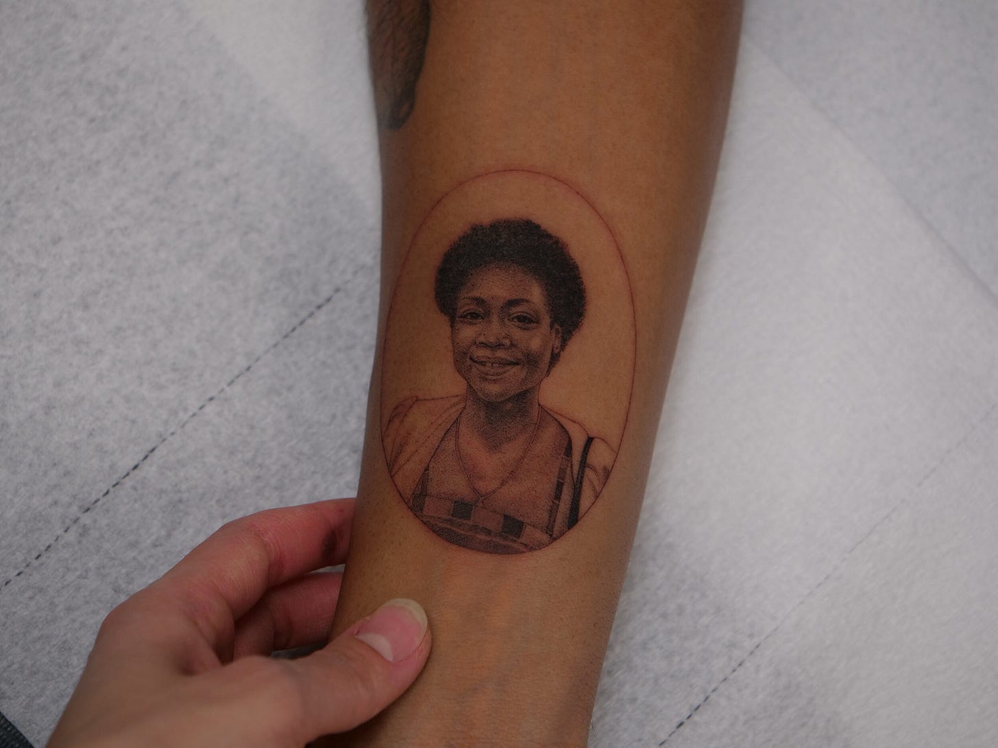 a person's arm with a tattoo on it