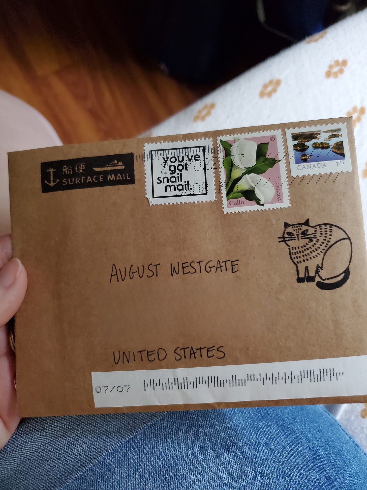 A kraft paper envelope with several stamps, addressed to August Westgate.