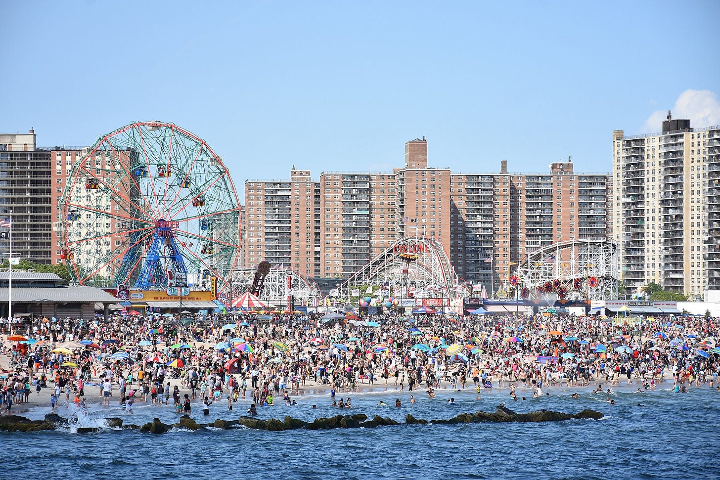 Coney Island beach, amusement parks, and high-rises, as seen from the pier in June 2016