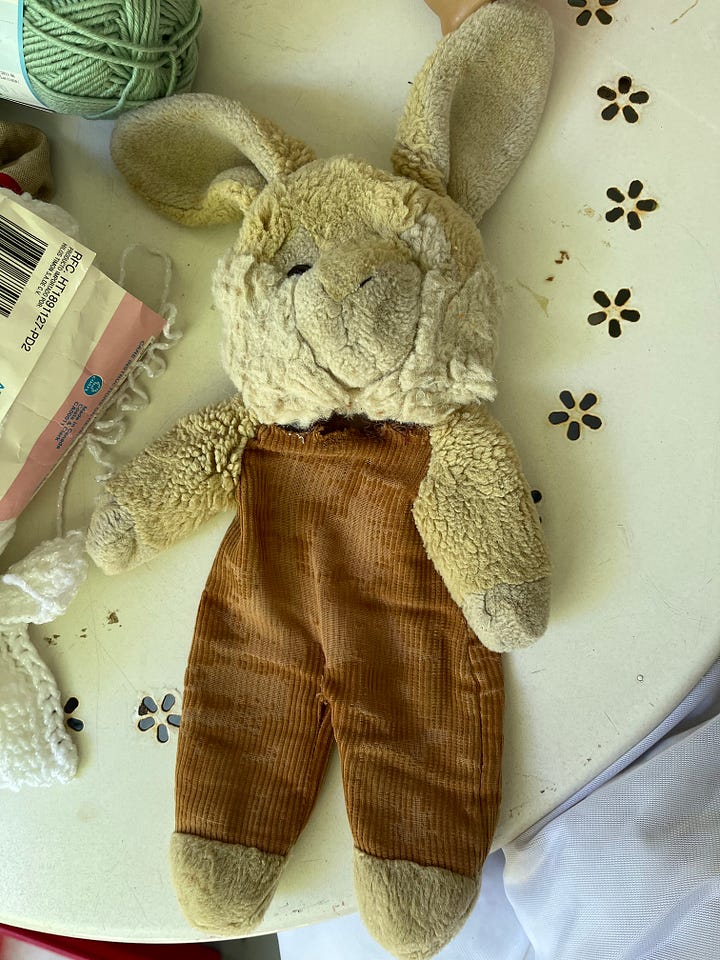 An American girl doll and a plush bunny rabbit.