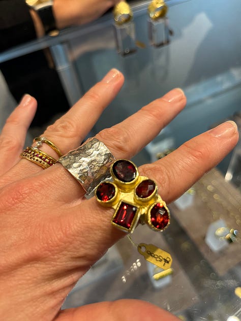 A ring by Castro Smith, a bracelet by Joanne Thompson, inside Goldsmiths' Hall, a brooch by Ella Fearon-Low, rings by Disa Alsopp, the gold Bombé woven ring by Megan Brown. They will all be exhibiting at the 42nd Goldsmiths' Fair.