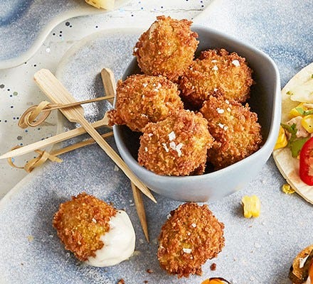 Deep-fried olives served on skewers
