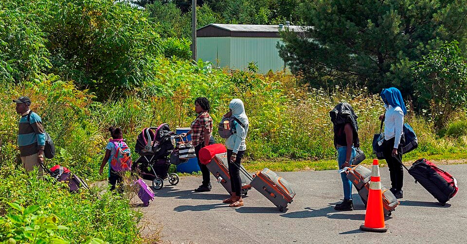 File:Asylum seekers lining up to enter Canada from end of Roxham Road, Champlain, NY.jpg
