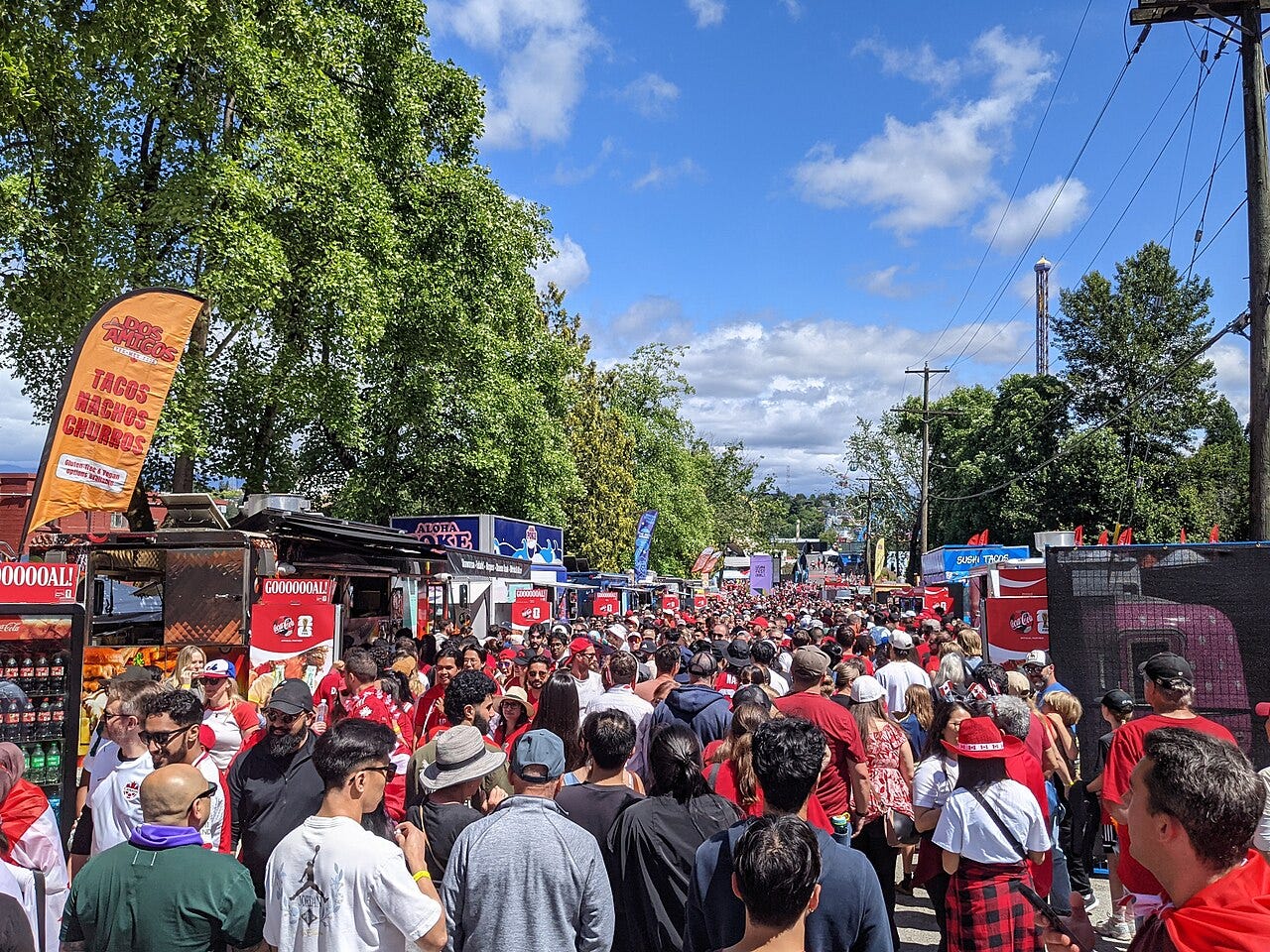 Photo: Northwest / Wikimedia Commons (CC BY 4.0) Crowd at the official Vancouver Fan Festival for the 2026 FIFA World Cup at Hastings Park in Vancouver, British Columbia, Canada. This is after Canada's national soccer team Round of 32 match against South Africa, which they would win 1–0 at Los Ange