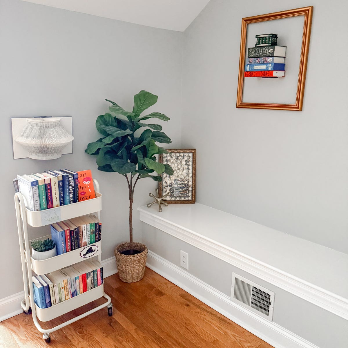 reading corner with book art and book cart.